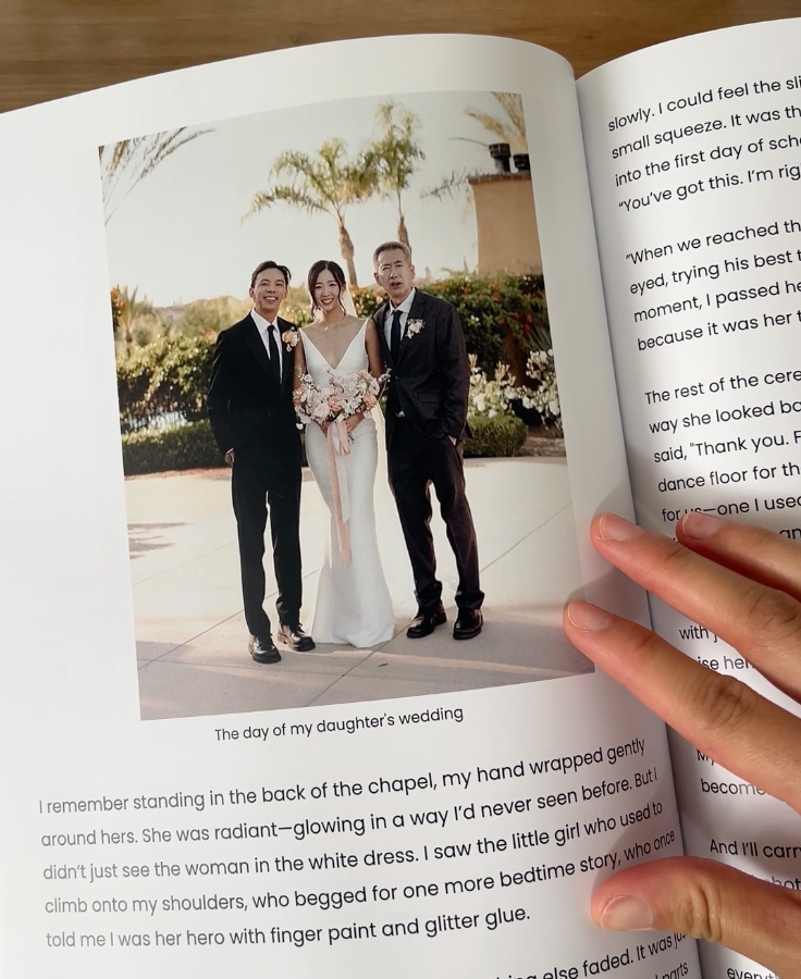 Inside pages of the Memorygram Legacy Book showing stories and photos