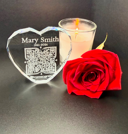 Heart crystal memorial keepsake displayed with candle and rose