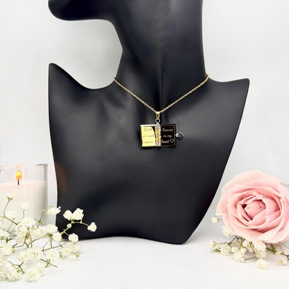 Open book necklace with short messages engraved inside the pages